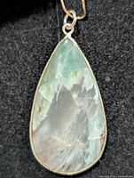 Front view of amazonite pendant showing stone color and bezel