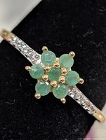 Close-up of emerald cluster and CZ shoulder