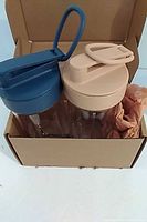 Both blender vessels in original box