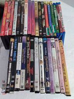 Full view of both rows of DVD cases (31 total)