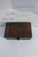 Closed long box marked 93-94 Basketball Upper Deck with small tin