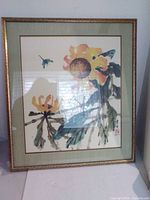 Full view of framed print showing sunflower and dragonfly imagery