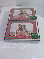 Front view of two stacked sealed boxes showing design and Hallmark branding