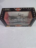 Front window view of boxed Maisto Harley-Davidson FXDB motorcycle