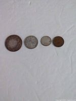 Four Canadian coins in size order