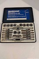 Full view of open case showing all 24 pieces arranged in tray