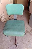 Full view of chair showing backrest, seat, and base