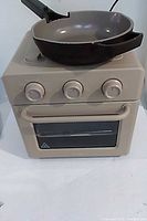 Wonder Oven front view with skillet resting on top