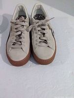 Top view of both sneakers showing laces, toe condition, interior pattern