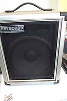 Front view showing Roland KEYBOARD badge, grille and speaker