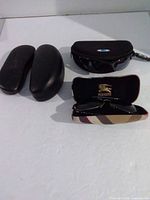 Overview of all cases and sunglasses in lot