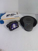 Group view of Aiwa cassette player, RCA speaker phone, D-Link KVM switch box