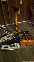 Overall view: Bauer skates, yellow floor pump, two Continental tire boxes