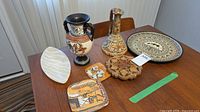 All seven decorative items on table
