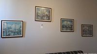 All four framed prints hanging on wall