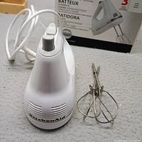 KitchenAid hand mixer with cord, beaters detached, shows overall condition