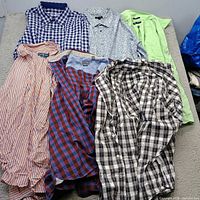 Six shirts laid out showing patterns and colors