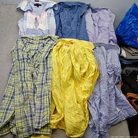 Six shirts laid out showing patterns and colours