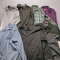 All seven shirts laid out showing styles and colors