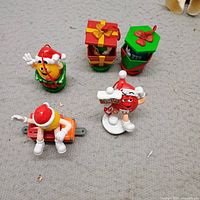 All five M&M's Christmas toppers and ornaments grouped