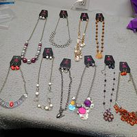 All ten jewelry sets laid out on table