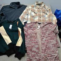 Group shot of four women’s XL sweaters and jackets