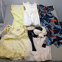 Overview of all five garments laid flat