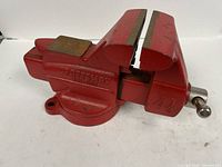 Side view showing full red Craftsman vise