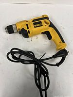 Full view of DeWalt DWD110 corded drill with attached power cord