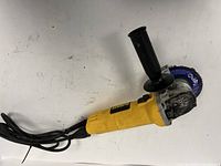 Full view of DeWalt angle grinder with handle and disc