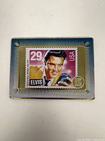 Front view showing Elvis 29¢ stamp image on gold-tone plaque