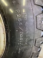 Sidewall showing size marking P265/70R17 and specification