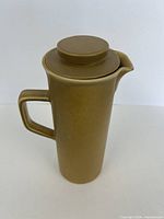 Full view of coffee pot with lid on