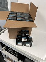 Open carton showing multiple Philips sealed beam lamp boxes