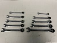 Ten Mastergrip ratcheting wrenches laid out showing both rows