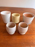All five planters grouped on table