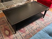Full view of rectangular black coffee table in living room