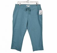 Full view of front of turquoise capri pants with tags attached