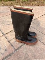 Side view of both boots showing height and color contrast