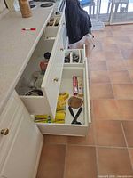 Open drawers showing location and variety of utensils and wraps