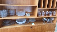 Entire lot inside cabinet showing bowls, large bowl, tumblers, snifters, plates