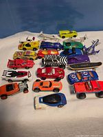 Group shot of all vehicles laid out on white cloth