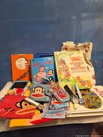 Group shot of entire lot displaying books, SpiroTot set, pouches, watches and tote bag