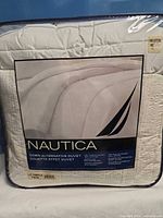 Front of packaged Nautica duvet showing logo and product info