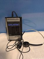 Front view Sony WM-F41 Walkman with earphones