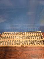 Two sealed cardboard cases of glass candle holders side by side