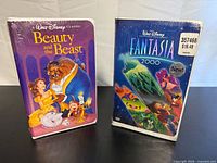 Front view of both sealed VHS tapes showing cover art and shrink wrap
