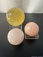 All three crystal spheres on acrylic stands