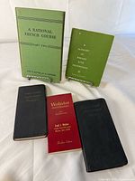 Five books standing/lying to show covers