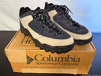 Oblique view of both shoes on original Columbia box